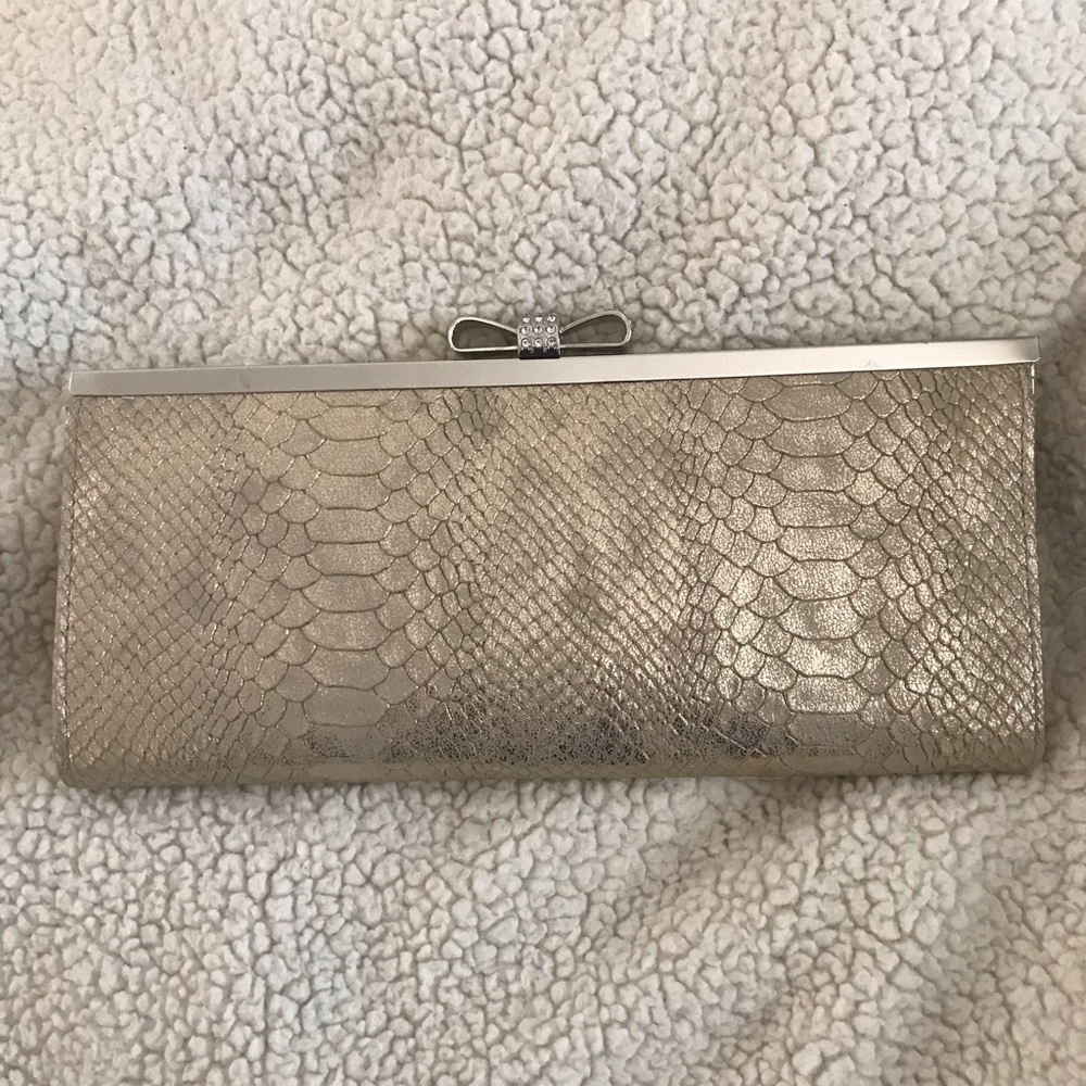 INC International Concepts's gold clutch
